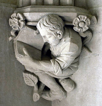 architectural detail of statue of man with book
